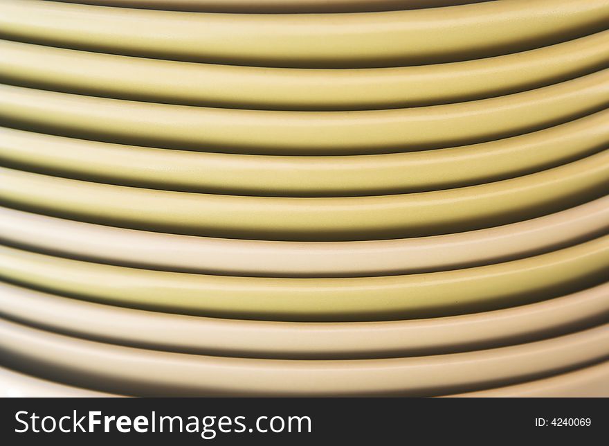 Smiling dishes.Close-up of a stack of yellow dishes.