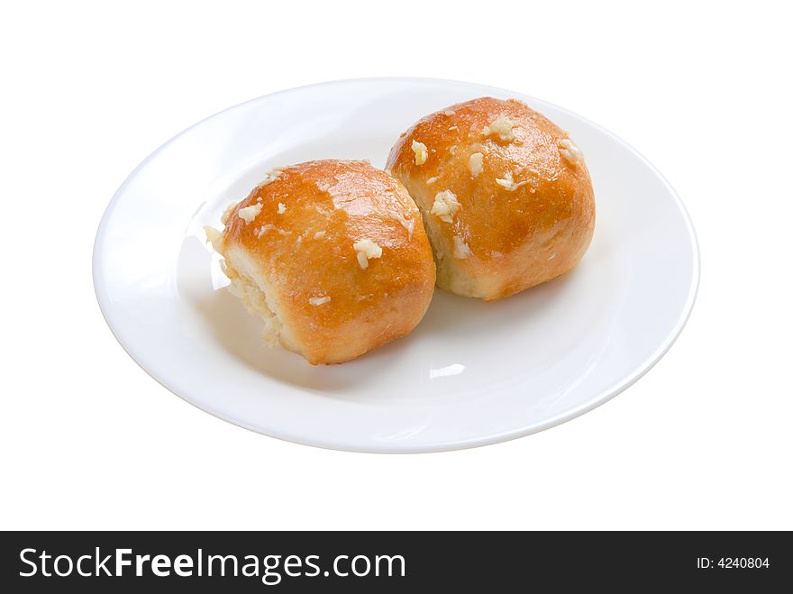 Two buns in white plate on white background, isolated. Two buns in white plate on white background, isolated
