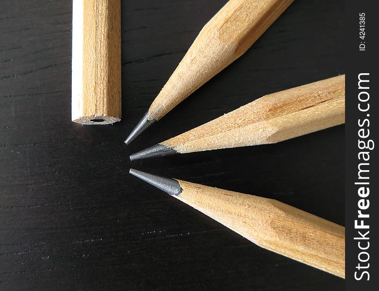 Four pencil on the black ,macro