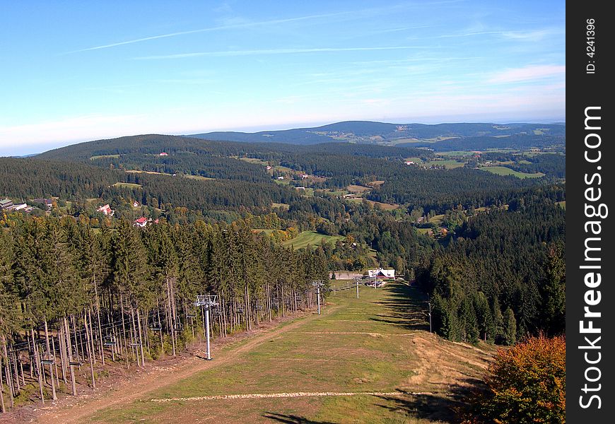 Ski slope in the Czech mountains Sumava with funicular at summer