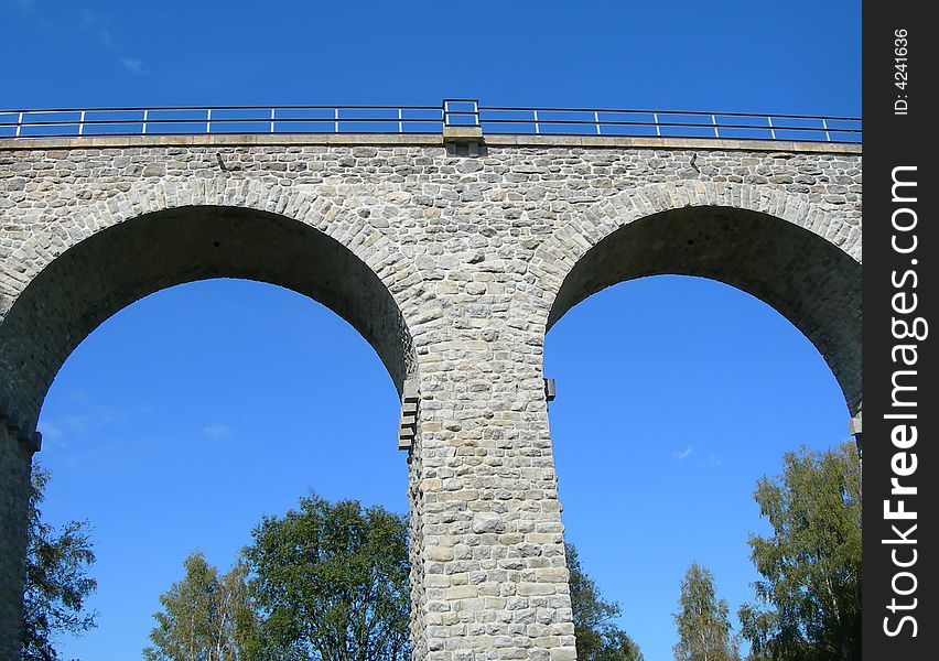 Two archs of a ancient stone railway bridge. Two archs of a ancient stone railway bridge