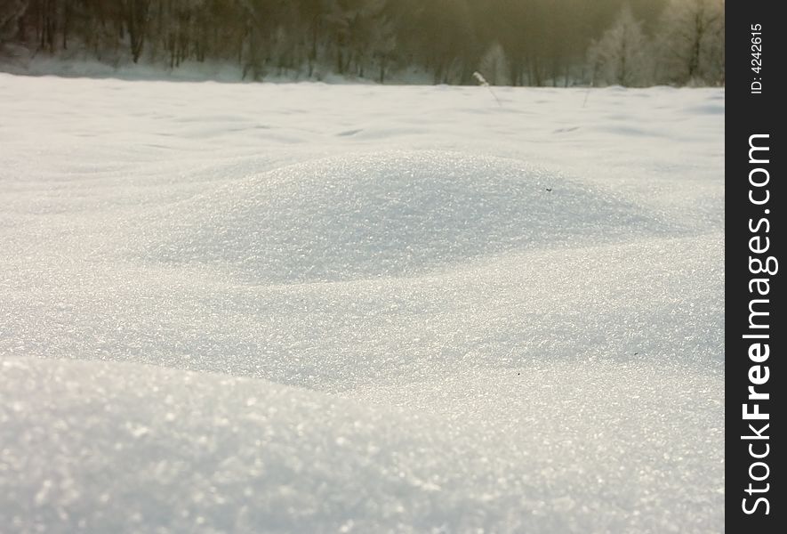 Snow dune, visible snow structure. Frosty winter day two years ago.