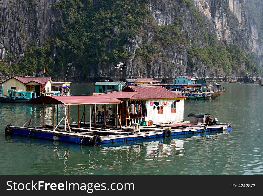 Halong bay, village on the river, vietnam