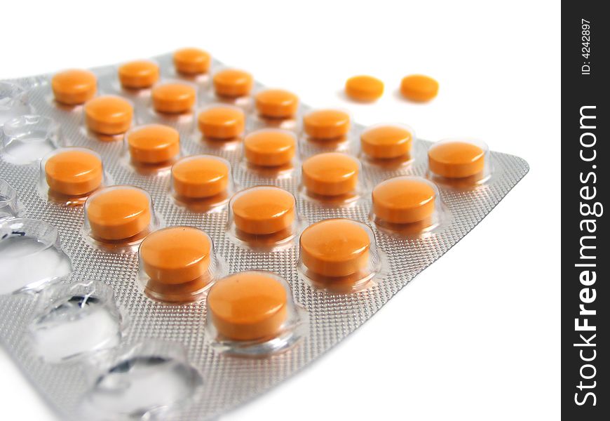 Close-up of a pack of orange pills