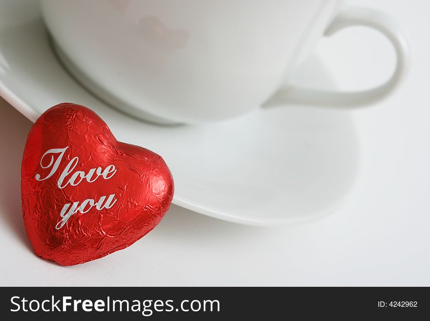 Coffee cup with heart on white background. Coffee cup with heart on white background.