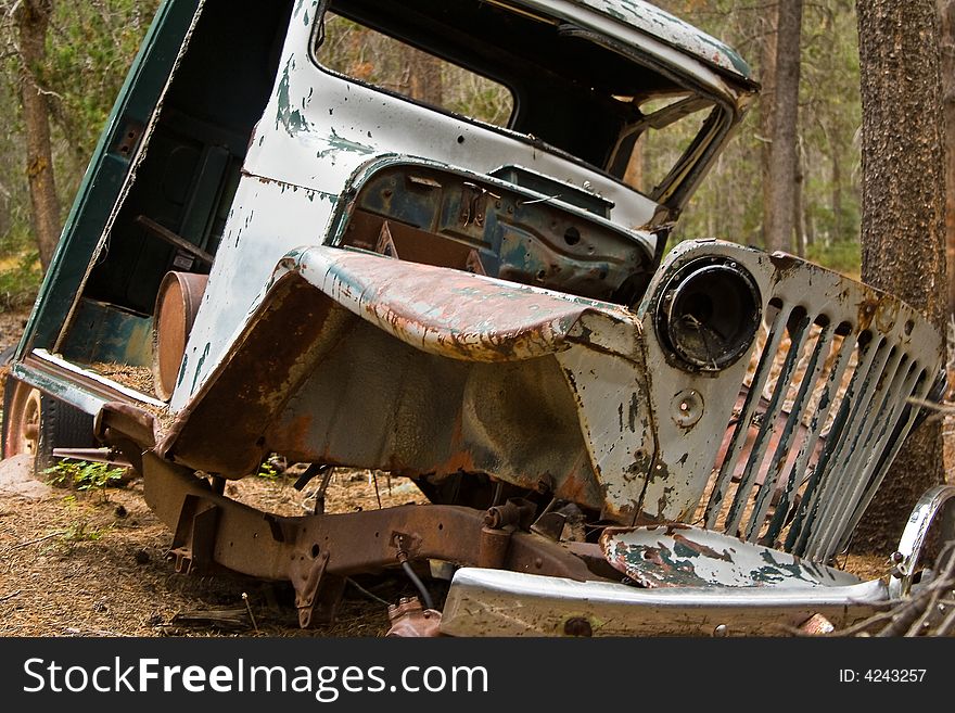 The front view of a jeep that looks like it has been through an earthquake and only part of it remained. The front view of a jeep that looks like it has been through an earthquake and only part of it remained.