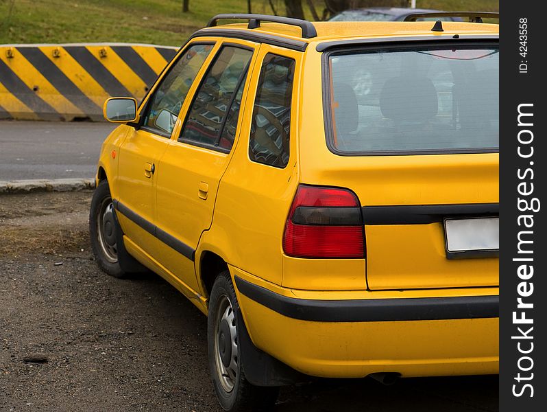 Yellow car near the road