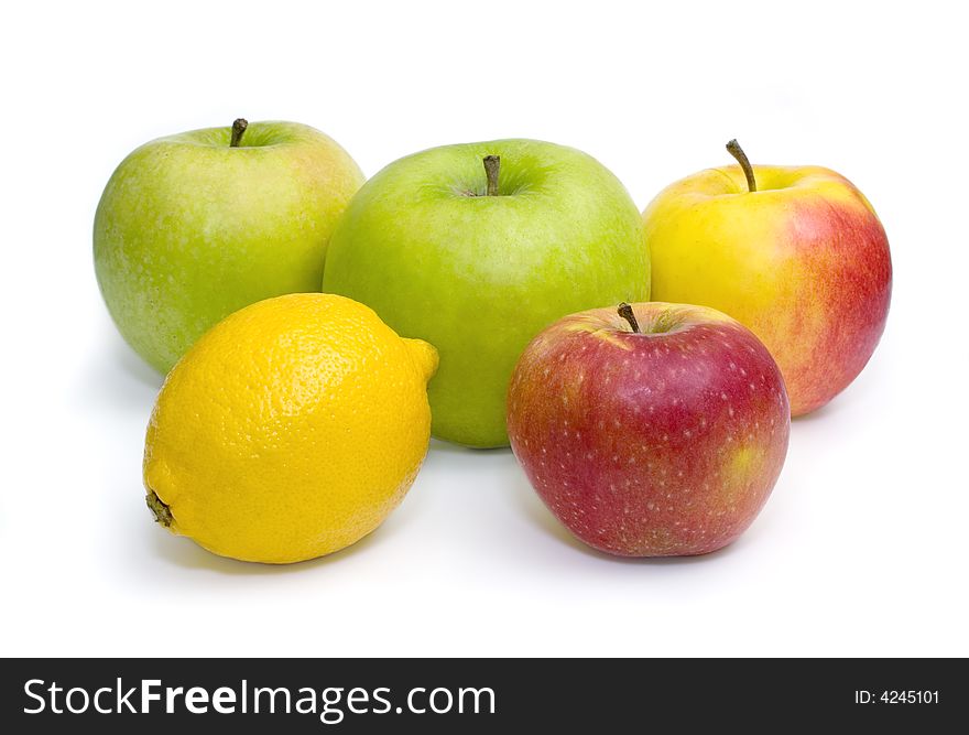 Group of four apples and lemon isolated on white background