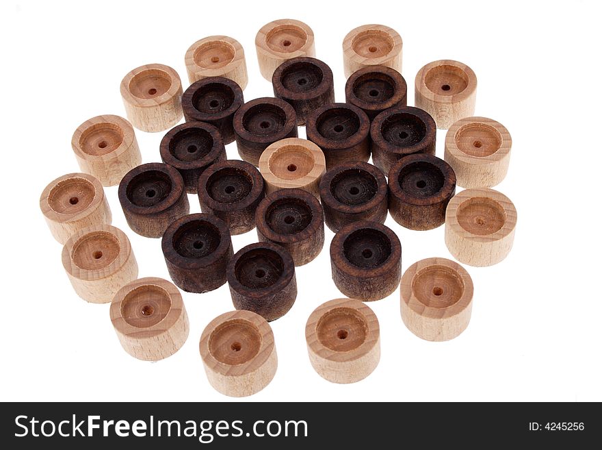 Black and white wood round pieces all around each other isolated on white background. Black and white wood round pieces all around each other isolated on white background