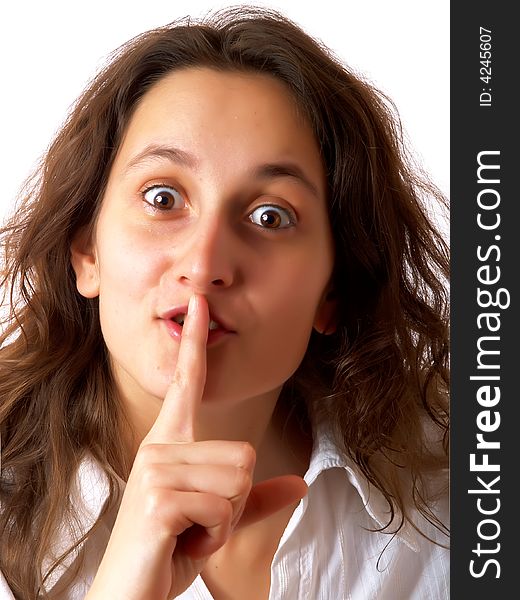 Girl demanding silence with her finger on the mouth. Girl demanding silence with her finger on the mouth