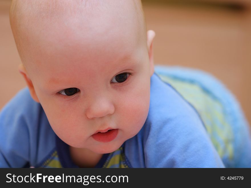 Baby crawling on bed. Close-up. Baby crawling on bed. Close-up.