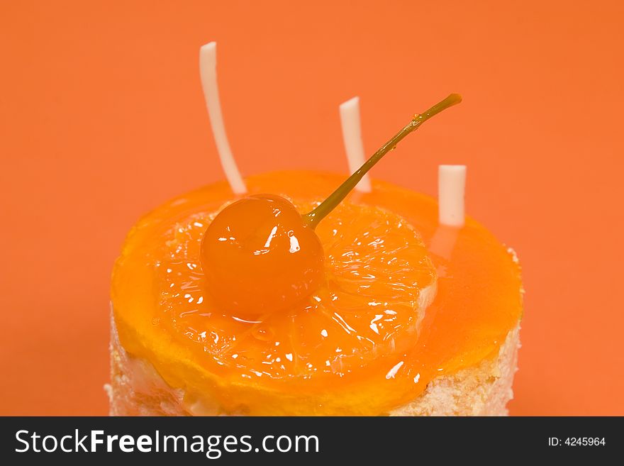 Orange cake on orange background. Dessert series. Orange cake on orange background. Dessert series.