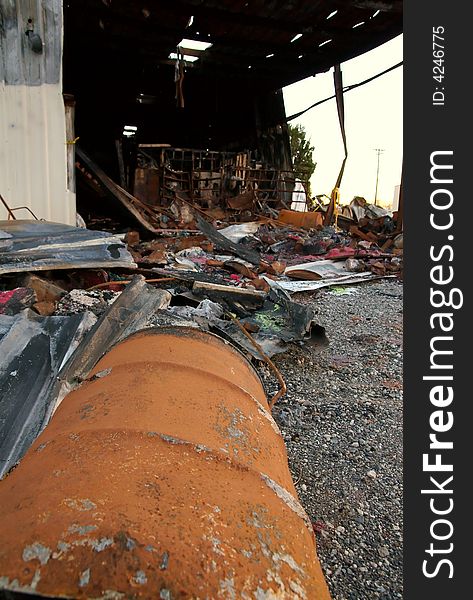 The debris of a warehouse factory building after a fire. The debris of a warehouse factory building after a fire.