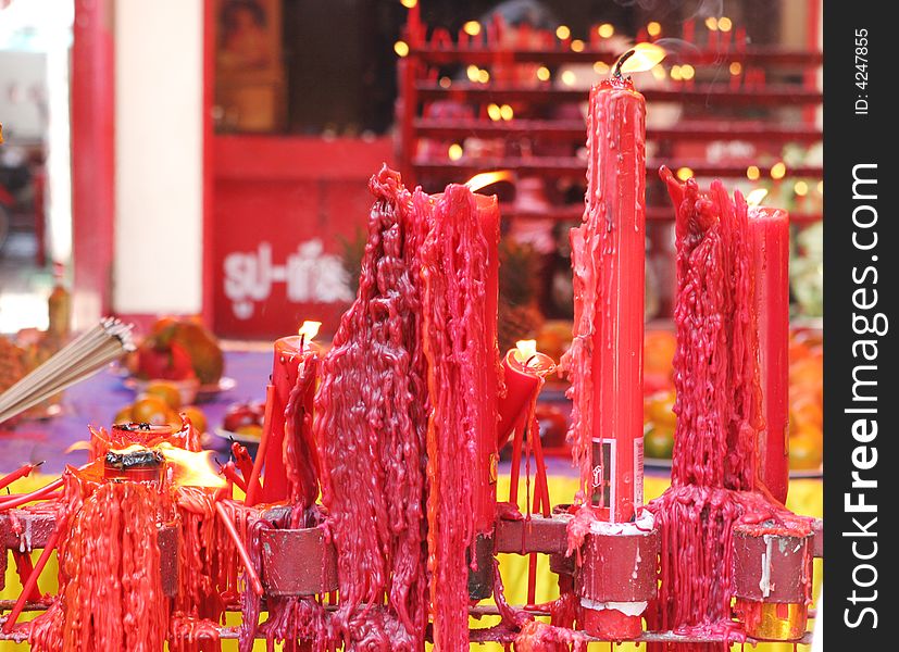 Candles burn at a Chinese temple. Candles burn at a Chinese temple.