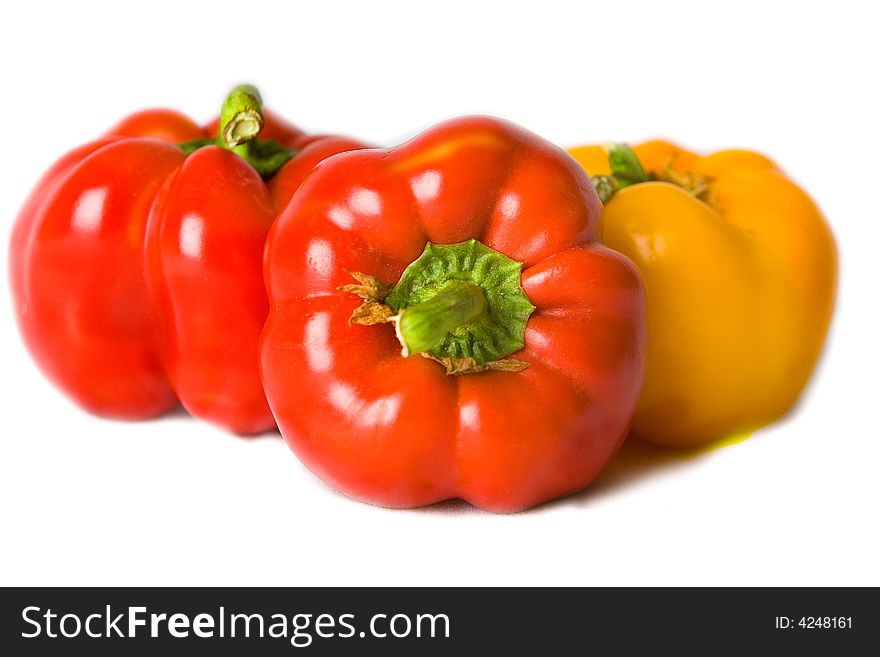 Fresh Red and Yellow Bell Peppers isolated on a white background. Fresh Red and Yellow Bell Peppers isolated on a white background.