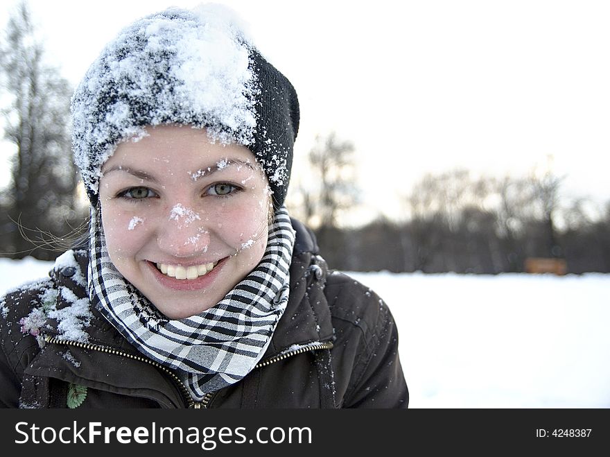 Nice girl's face in snow. Nice girl's face in snow