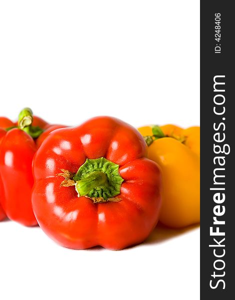 Fresh Red and Yellow Bell Peppers isolated on a white background. Fresh Red and Yellow Bell Peppers isolated on a white background.