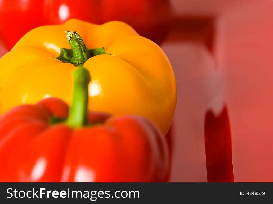 Macro of fresh red and yellow bellpeppers.