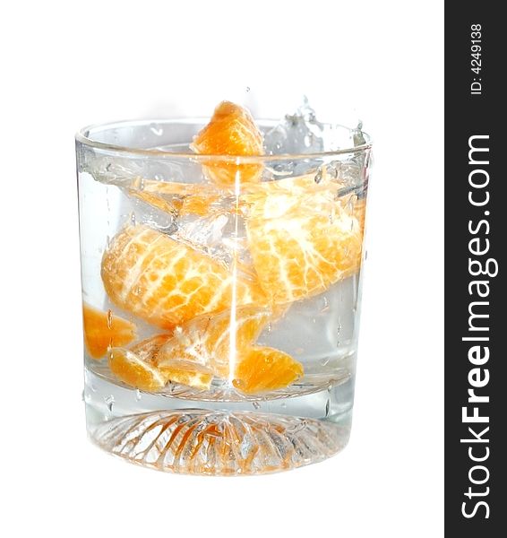 Fresh tangerines in a glass of water