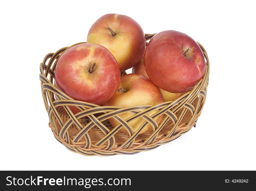 Apples in a basket isolated on white background