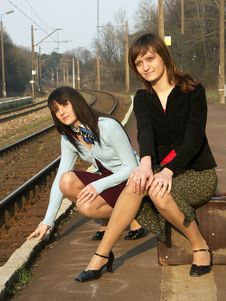 Girls Waiting For The Train Stock Photos