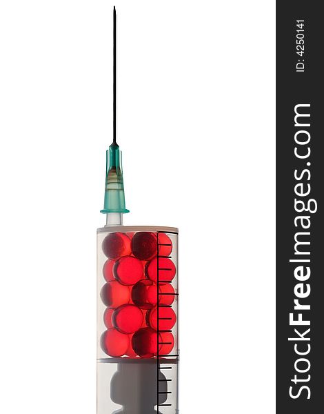 Red pills in a syringe. Close-up. Isolated on white. Red pills in a syringe. Close-up. Isolated on white.