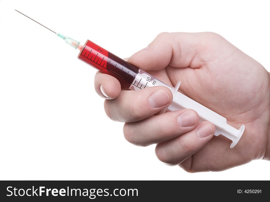 The man's hand holds syringe with red liquid. Isolated on white. The man's hand holds syringe with red liquid. Isolated on white.