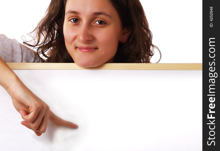 Young woman holding and showing a wite board, with a copy-space. Young woman holding and showing a wite board, with a copy-space