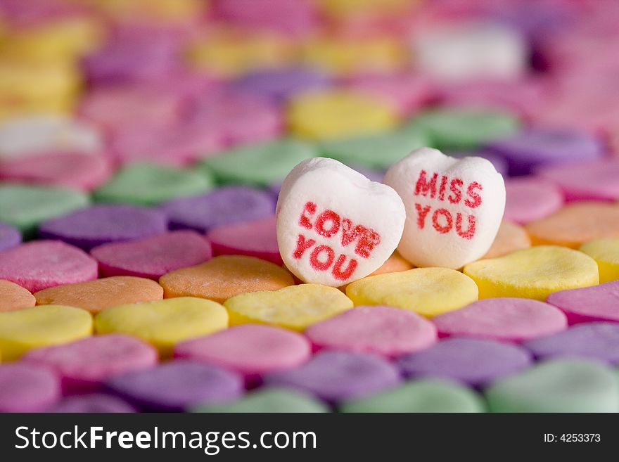 Closeup of colorful Valentine hearts with romantic words with small focus range. Closeup of colorful Valentine hearts with romantic words with small focus range.
