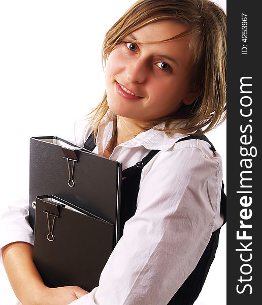 Young businesswoman at work, holding folders