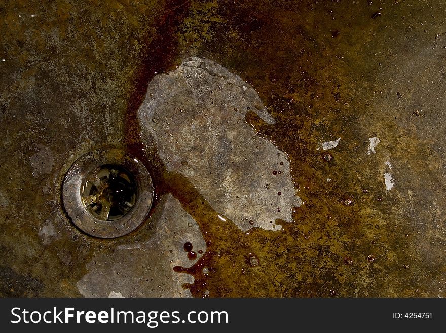 The old bowl, rusty, flows water, a drain