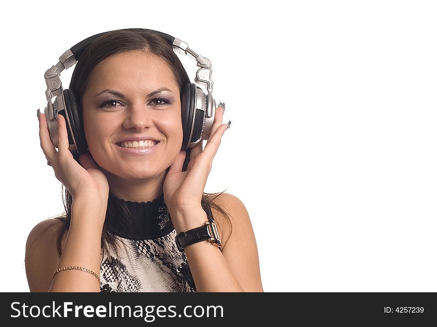 The beautiful girl with headphones on a white background. The beautiful girl with headphones on a white background