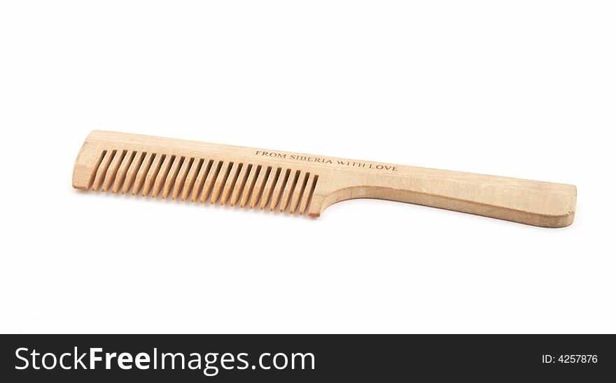 Wooden hairbrush on a white background