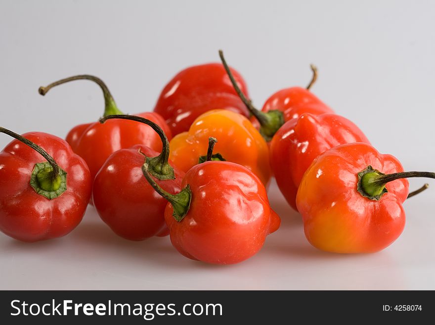 Small fresh peppers on neutral background