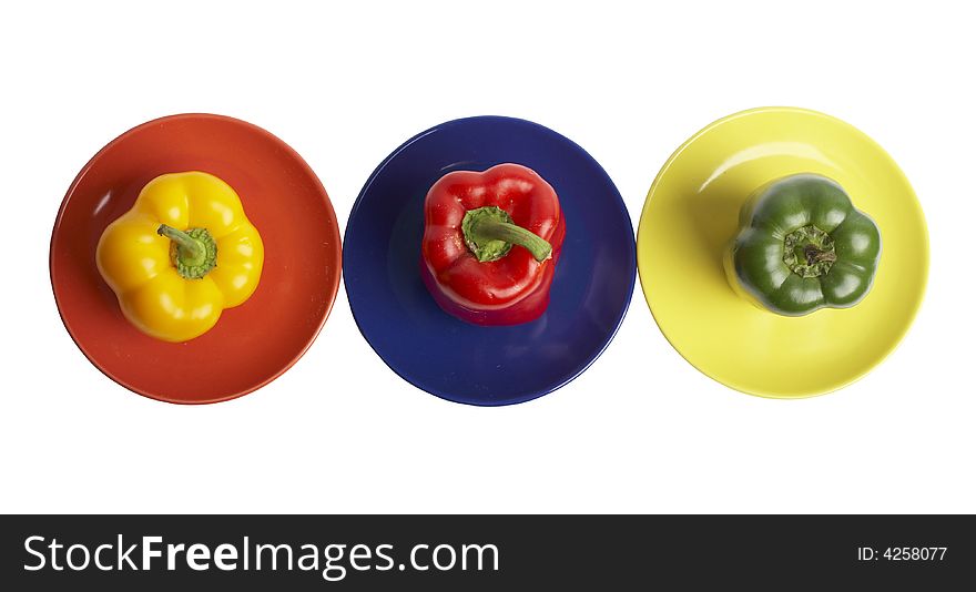 An image of a varicoloured peppers isolated on white.