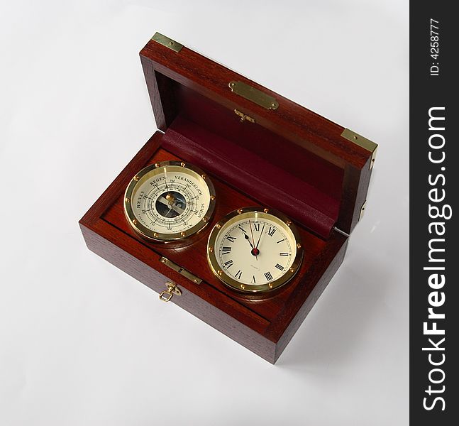 Old redwood box with watch and barometer inside  on white background. Old redwood box with watch and barometer inside  on white background