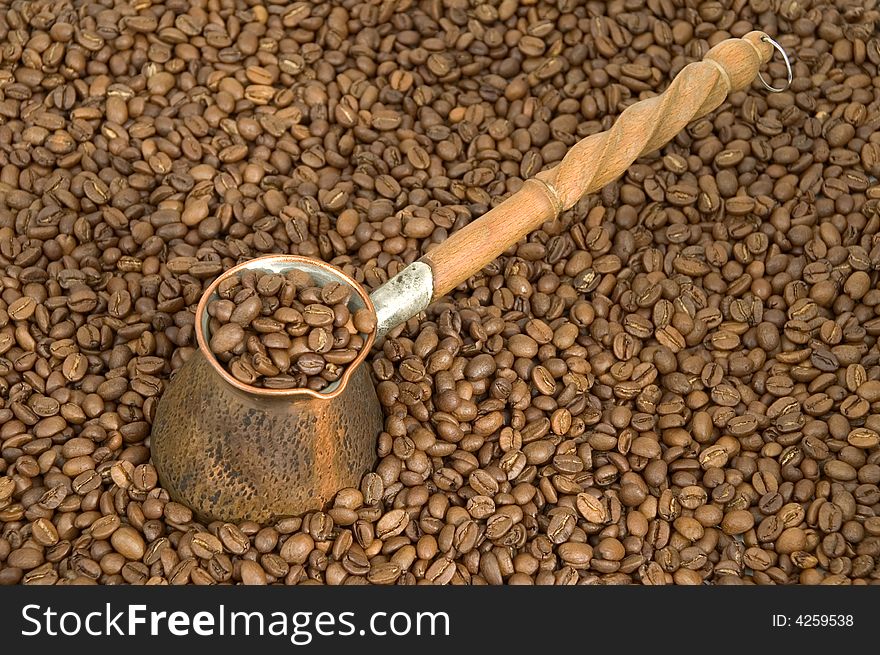 Turkish coffee pot and coffee beans. Turkish coffee pot and coffee beans.