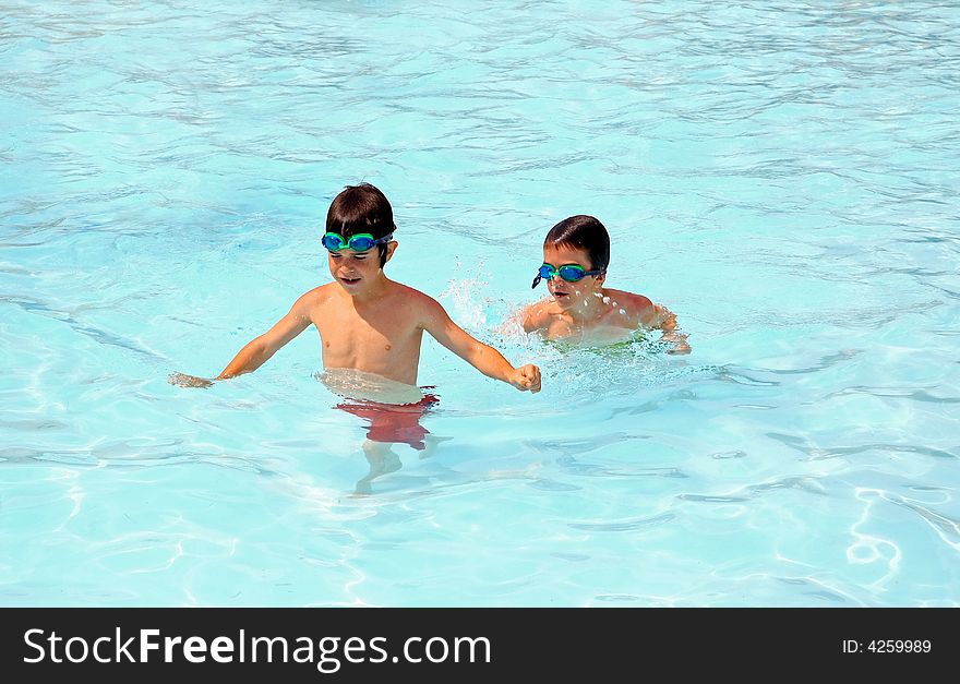 Two Little Boys Playing in the Pool