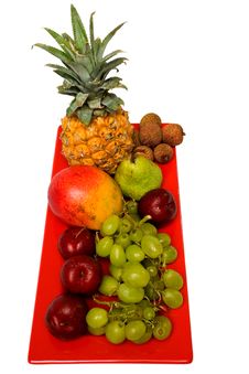 Fresh Fruit On A Red Plate. Royalty Free Stock Photo