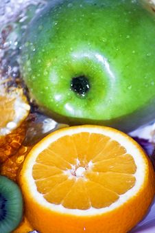 Green Apple And Orange Slice In Fresh Water Stock Photo Green Apple And Orange Slice In Fresh Water Stock Photo