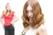 Brunette Girl Outstrip Blond Colleague Royalty Free Stock Photos
