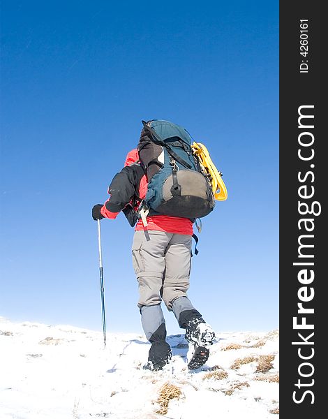 Tourists are in winter in mountains