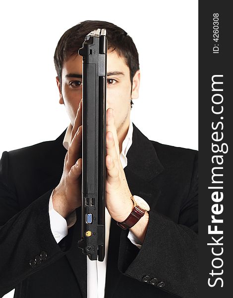 Businessman holding the laptop in front of his face. Businessman holding the laptop in front of his face