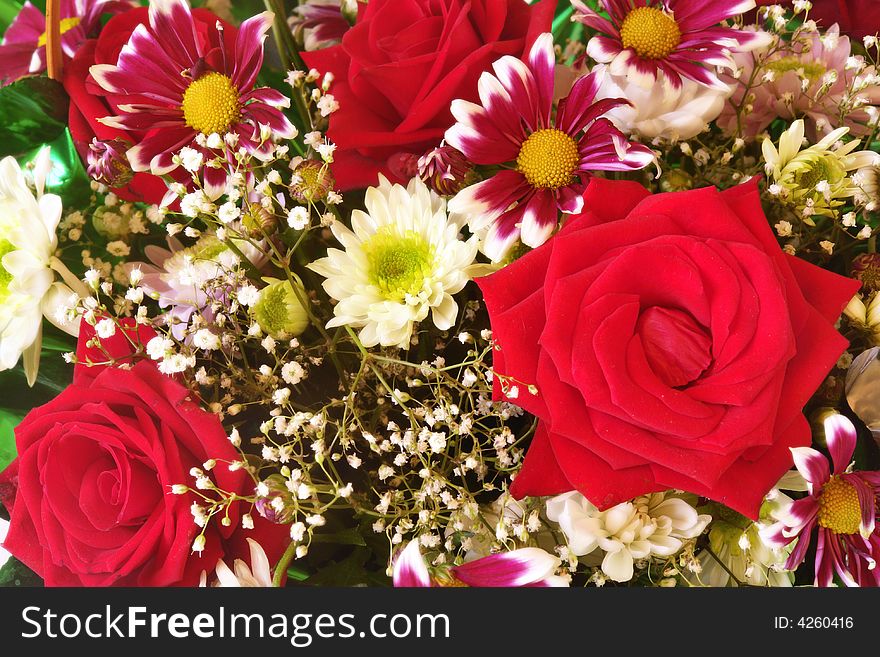 Colorful flower background with roses and chrysanthemums