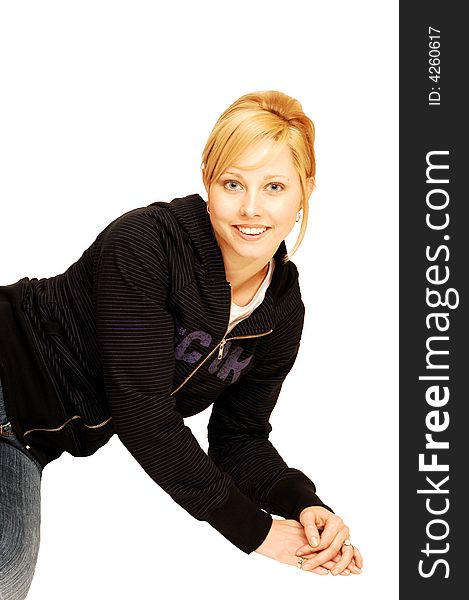 A single pretty girl, sitting on the floor over white background 
in jeans and an black sweater. A single pretty girl, sitting on the floor over white background 
in jeans and an black sweater.