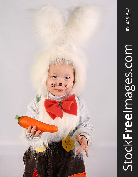 Girl in a white downy bunny costume. Girl in a white downy bunny costume.