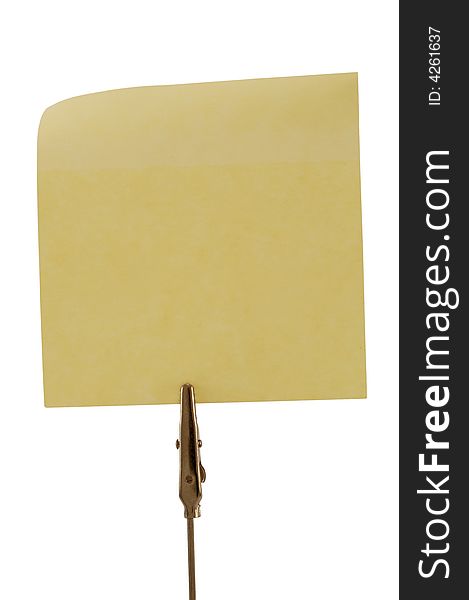 Clamp holding one yellow post-it, isolated on white. Clamp holding one yellow post-it, isolated on white.