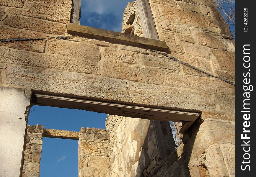 Ruins of an old stone house against a clear blue sky. Ruins of an old stone house against a clear blue sky