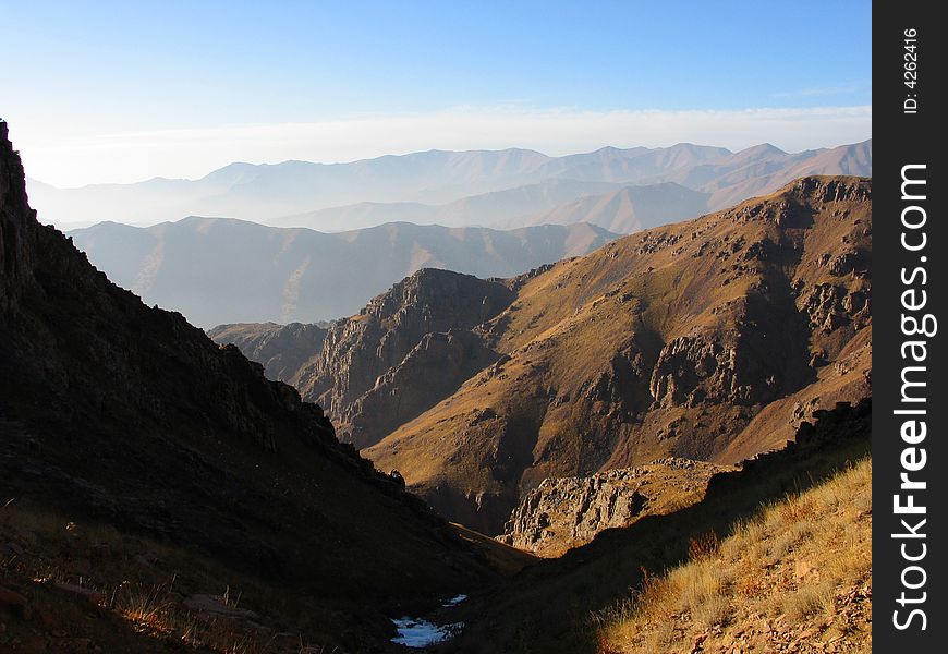 Dark and light slopes on mouantain range background. Dark and light slopes on mouantain range background