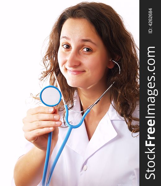 Female doctor holding a stethoscope and smiling. Female doctor holding a stethoscope and smiling